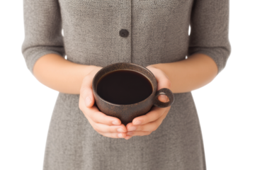 Female hands holding ceramic cup of coffee in gray dress, cut out