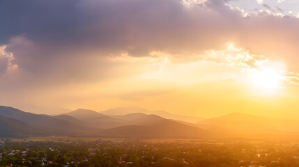 Golden sunset over a serene landscape, warm light through clouds, orange and purple hues blending in harmony