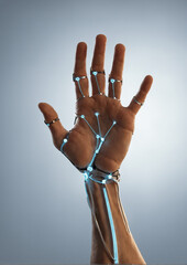 Futuristic robotic hand with glowing circuits illustrating technology innovation