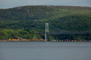 Freight train passing through Bear Mountain bridge in New York state.