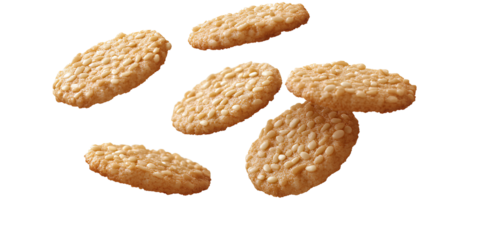 Sesame crisp cookies floating in the air, isolated on a transparent background