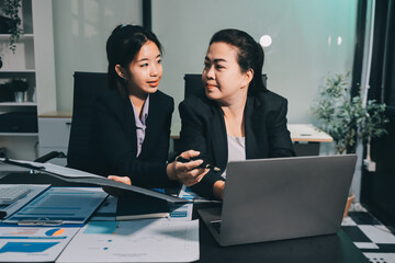 Entrepreneurs and business people conference in modern meeting room, happy multiracial coworkers have fun cooperating working together at office meeting, asian teamwork concept