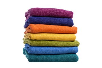 Stacked colorful towels in rainbow order on black background, cut out
