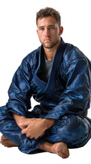 Obraz premium Serene Focus: A martial artist in a striking blue gi, embodying strength and calm as he sits in a meditative pose. This image encapsulates the discipline and inner peace of martial arts.