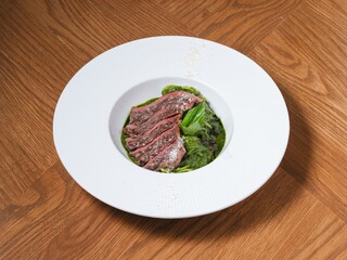 Grilled Beef Steak with Basil Pesto Spaghetti on White Plate