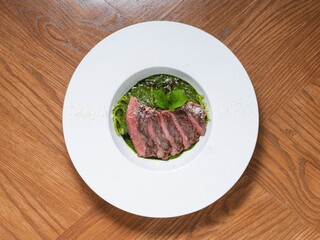 Grilled Beef Steak with Basil Pesto Spaghetti on White Plate