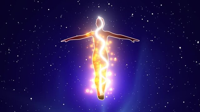 Silhouette of a person standing with his arms outstretched with the effect of kundalini energy flow