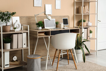 Modern stylish workplace with laptop and tablet in office
