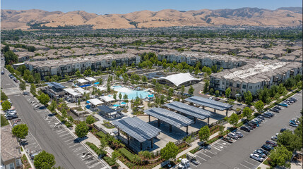 High Angle View of a Modern Residential Area with Solar Panels and Recreational Amenities for Eco Living