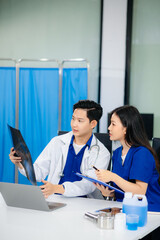 Professional healthcare team consultation a doctor and nurse collaborating in a clinic, discussing...