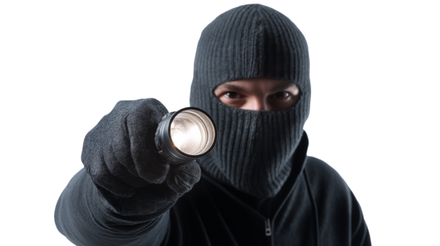A thief holding a flashlight isolated on white and transparent background, cut out png