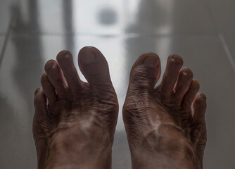 bare feet on a black background