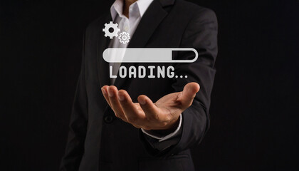 A person in a suit holds out their hand, with a digital loading bar and icons floating above it on a dark background.