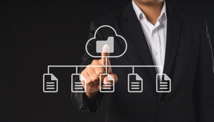 A businessman in a suit interacts with a virtual cloud storage interface, selecting a folder connected to multiple documents.