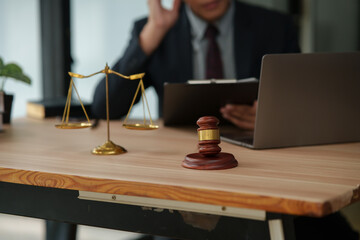 Male lawyer using phone to talk to client and give legal advice
