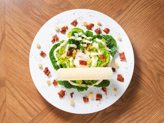 Caesar Salad with Crispy Bacon, Onsen Egg, and Croutons on White Plate