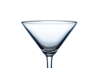 Crystal clear empty martini glass with elegant design on black background, cut out