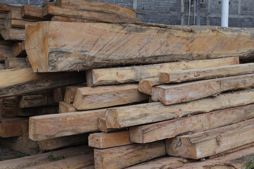 Teak wood log material ready to be processed into furniture in the factory