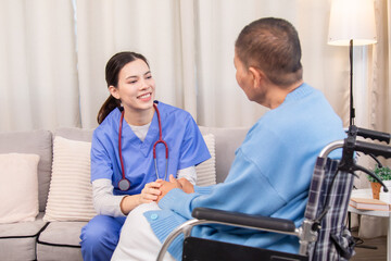 Obraz premium Senior woman in wheelchair discussing health with nurse on sofa, both smiling and sharing emotional connection, illustrating trust and support in home care setting, healthcare, illness, patient.