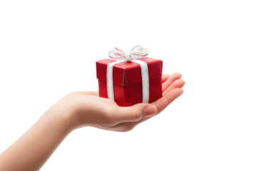 Female hand holding small red gift box with white ribbon, cut out