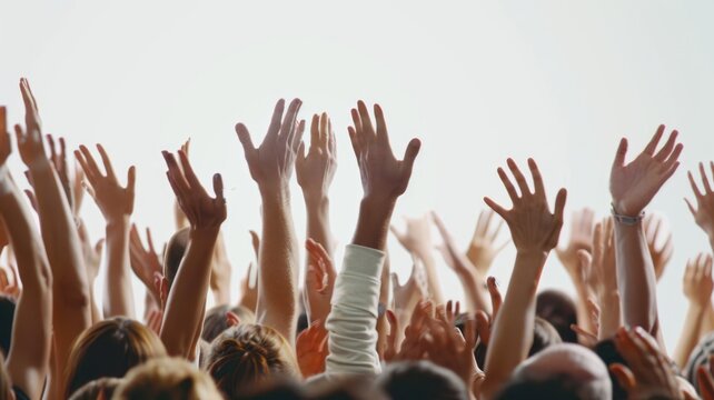 Abstract picture hands lifted upwards by individuals within a large gathering of people standing in unity group. Community raising arm celebrate in musical festival or join protesting activism. AIG53.