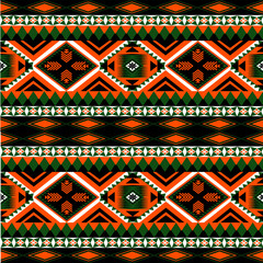 Seamless tribal ethnic pattern with bold geometric shapes in orange, green, and black. Ideal for fabric, fashion, and digital design.