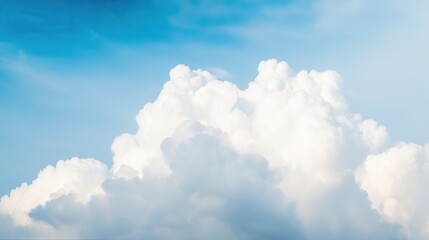 Fluffy white cloud in summer sky, peaceful and serene