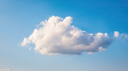 Fluffy white cloud in summer sky, peaceful and serene