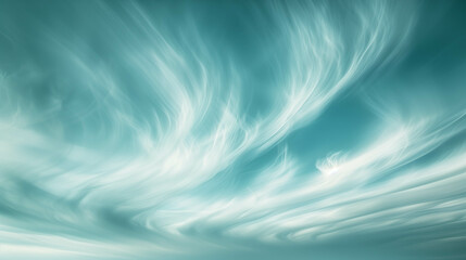 High-altitude cirrus clouds streaking across a vibrant turquoise sky