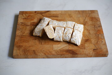 Tempeh on wooden board 