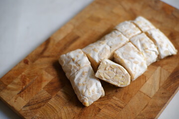 Tempeh on wooden board 