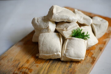 White tofu on wooden board 