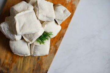 White tofu on wooden board 