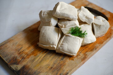 White tofu on wooden board 