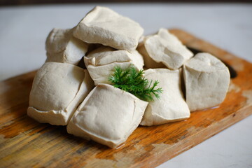 White tofu on wooden board 