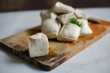 white tofu in wooden background 
