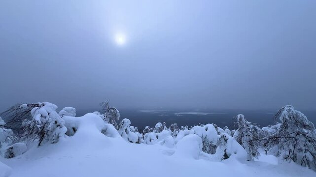 View of the white rocks and the winter forest on Mount Polyud. Lappish spruces on Mount Polyud in the Perm region in winter. In winter, there is a lot of snow and frost on the trees in the Urals. 4К