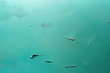 Close-up view of a turquoise textured surface with peeling and curling paint creating subtle shadows and smooth irregular patterns