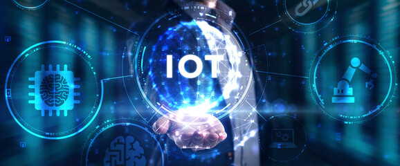 Internet of things - IOT concept. Businessman offer IOT products and solutions. The future of technology. Virtual screen of the future with the inscription: IOT.