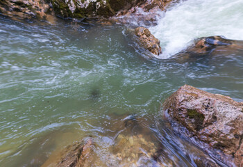 the source of the river in the wild, a walk along the riverbed with a view of the canyon