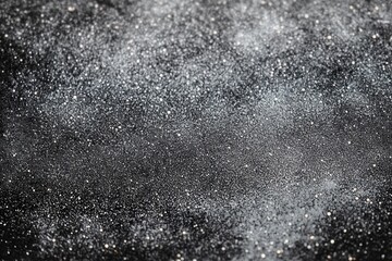 Obraz premium Close-up of black surface covered with tiny water droplets sparkling under soft light