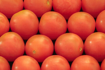 Close-up of fresh cherry tomatoes at a market.