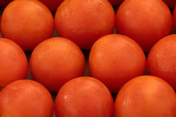Close-up of fresh cherry tomatoes at a market.