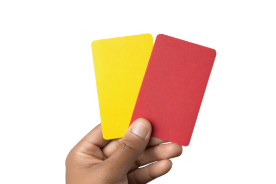 Hand holding yellow and red cards isolated on black background, cut out