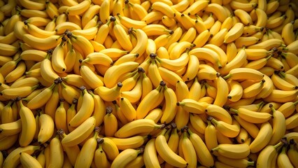 A large pile of ripe yellow bananas ready to eat