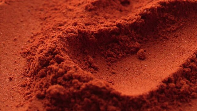 Macro video of red chilli powder kept on rotating disk. Close up of kashmiri chilli powder. 