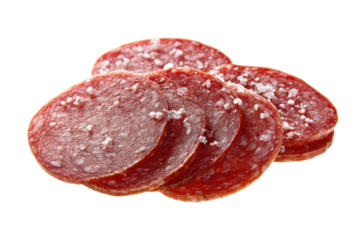 Close-up of sliced salami with visible spices on black background, cut out