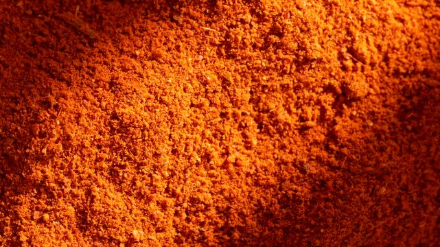 Macro video of red chilli powder kept on rotating disk. Close up of kashmiri chilli powder. 
