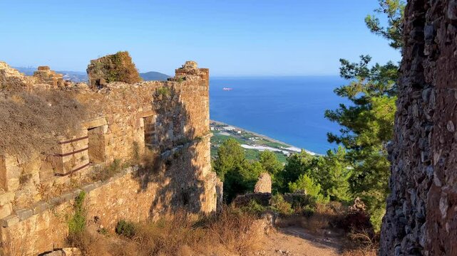 Ruins of the ancient Roman port city of Siedra in Alanya, Antalya, Turkey. The street and ruins of the ancient abandoned ancient city of Siedra on the Mediterranean coast. 4К
