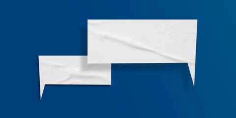 White speech bubble crumpled paper isolated on blue background